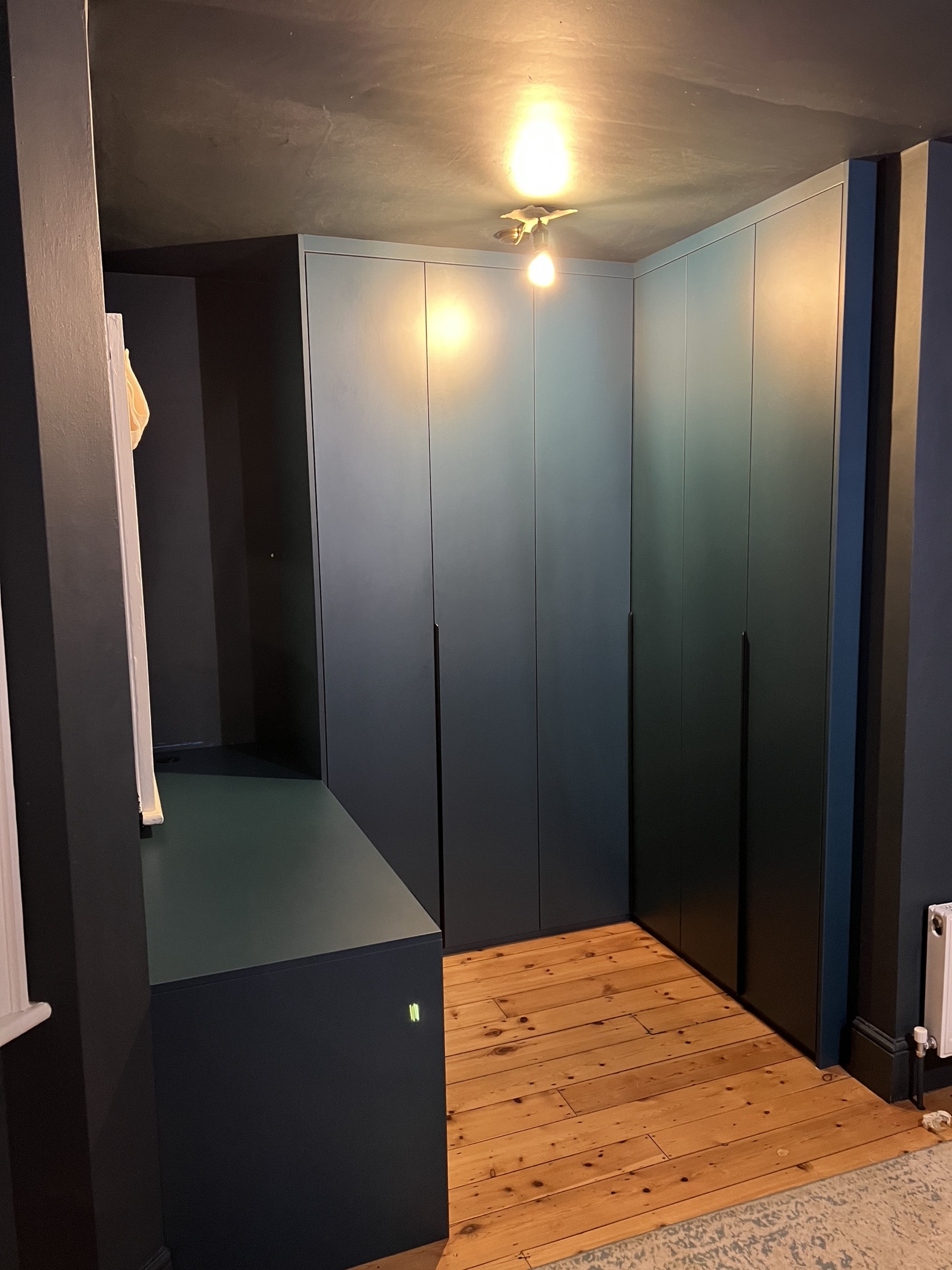 Completed NOAVE fitted wardrobe installation in a deep blue finish